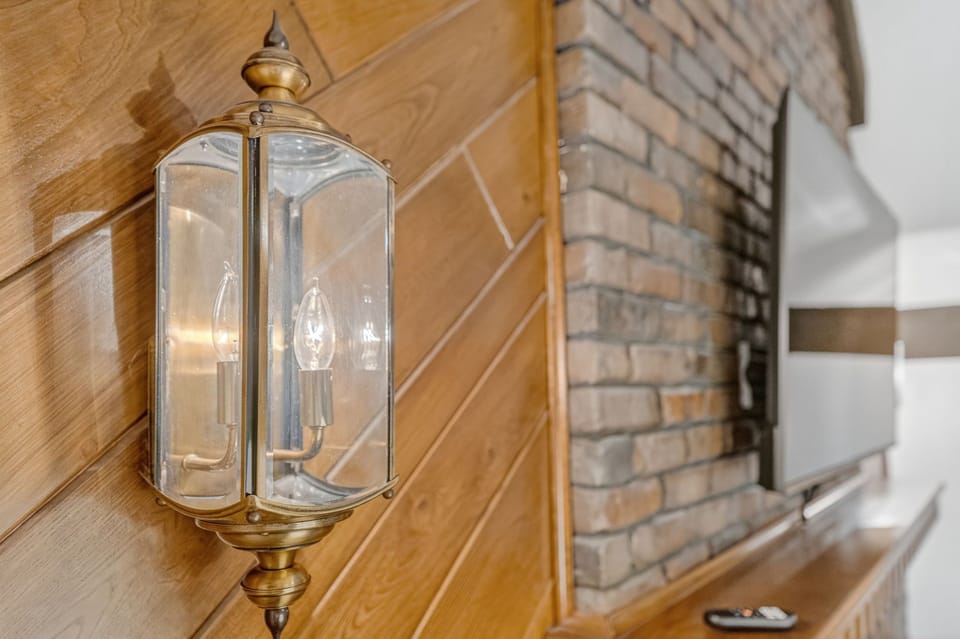 Rustic fireplace with warm wood accents and charming vintage character.