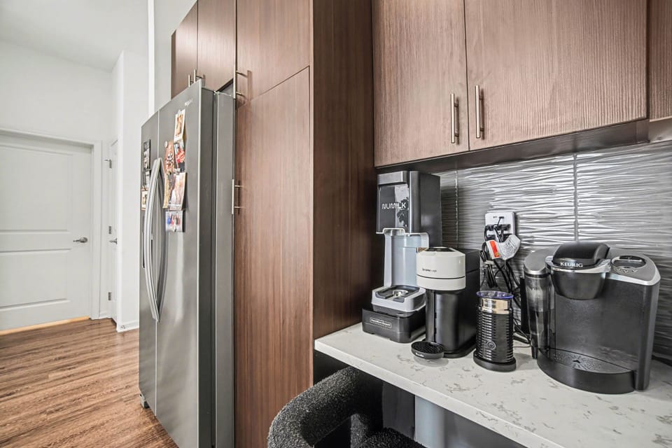 Upscale kitchen with coffee station and stylish cabinetry.
