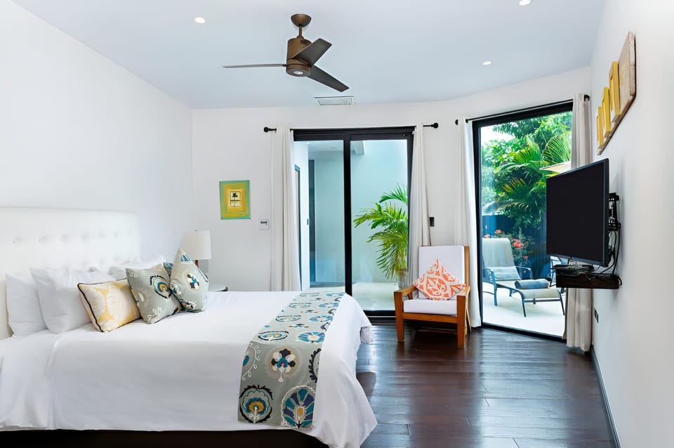 Wake up refreshed in a serene suite with patio access.