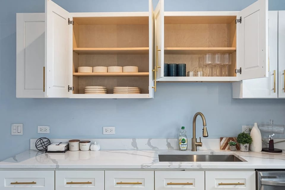 Bright kitchen featuring ample cabinetry, modern fixtures, and generous counter space for meal prep and everyday convenience.