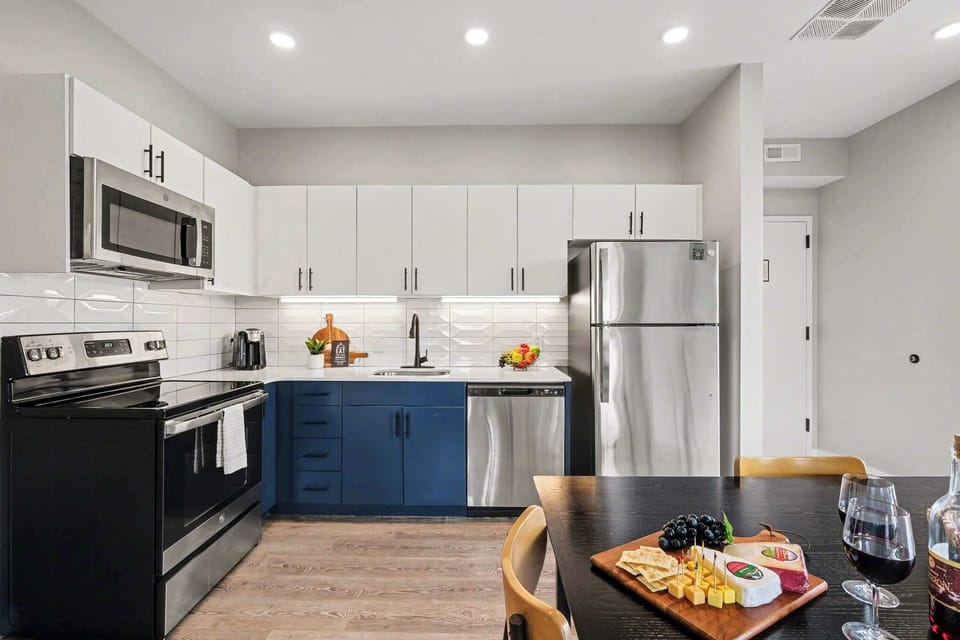 Bright, modern kitchen with stainless steel appliances, and generous cabinet space.