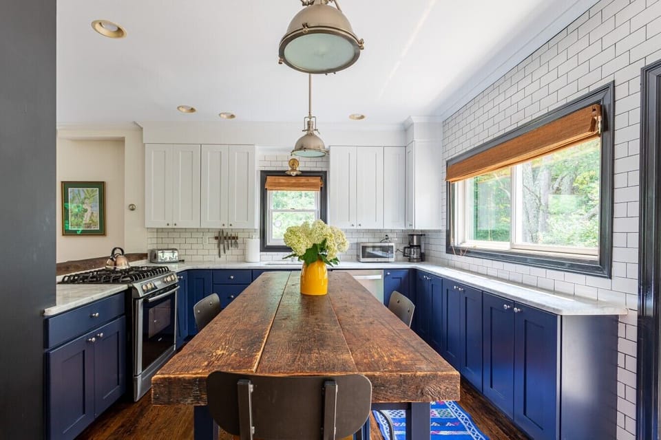 Gather around the oversized reclaimed wood island for morning coffee, family meals, or evening wine and conversation