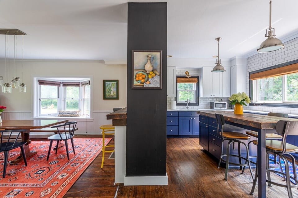 The spacious kitchen flows seamlessly into the dining area, creating the perfect setting for cooking together, sharing meals, and making memories