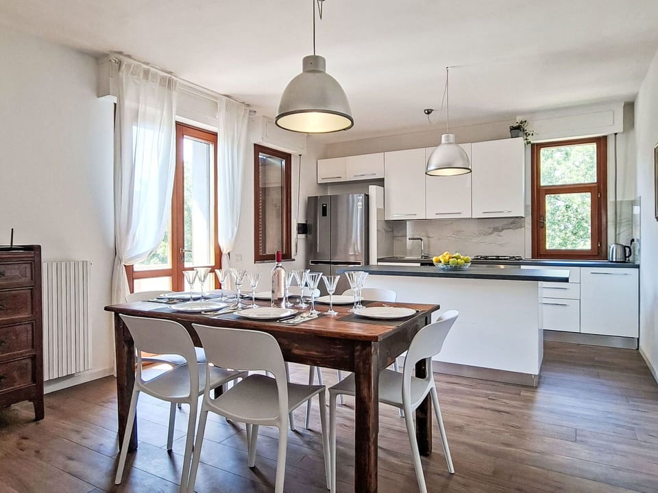 Furniture, Interior Design, Flooring, Chair, Wood, Kitchen & Dining Room Table, Table, Light Fixture, Floor, Dining Room