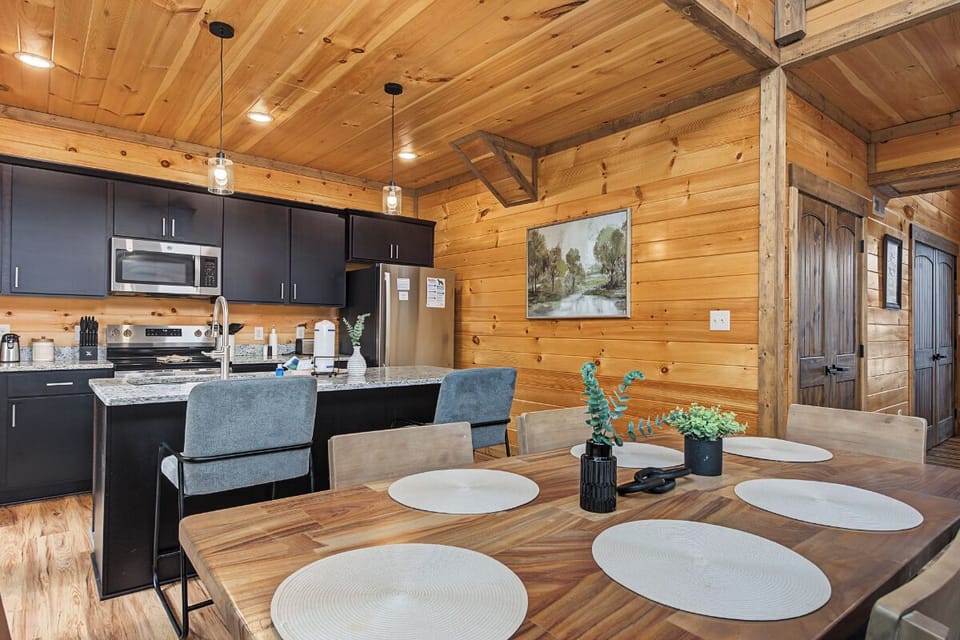 Gather around your spacious dining table under soaring vaulted ceilings, with a fully equipped kitchen ready for your group meals and mountain getaway feasts.