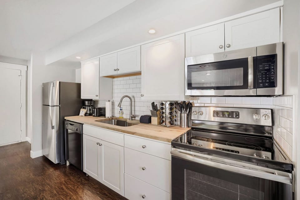 Your fully equipped kitchen features stainless steel appliances, butcher-block countertops, and all the essentials for preparing your favorite home-cooked meals during your stay.