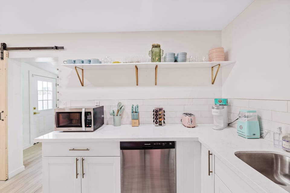 Bright modern kitchen with coffee station and sleek stainless appliances