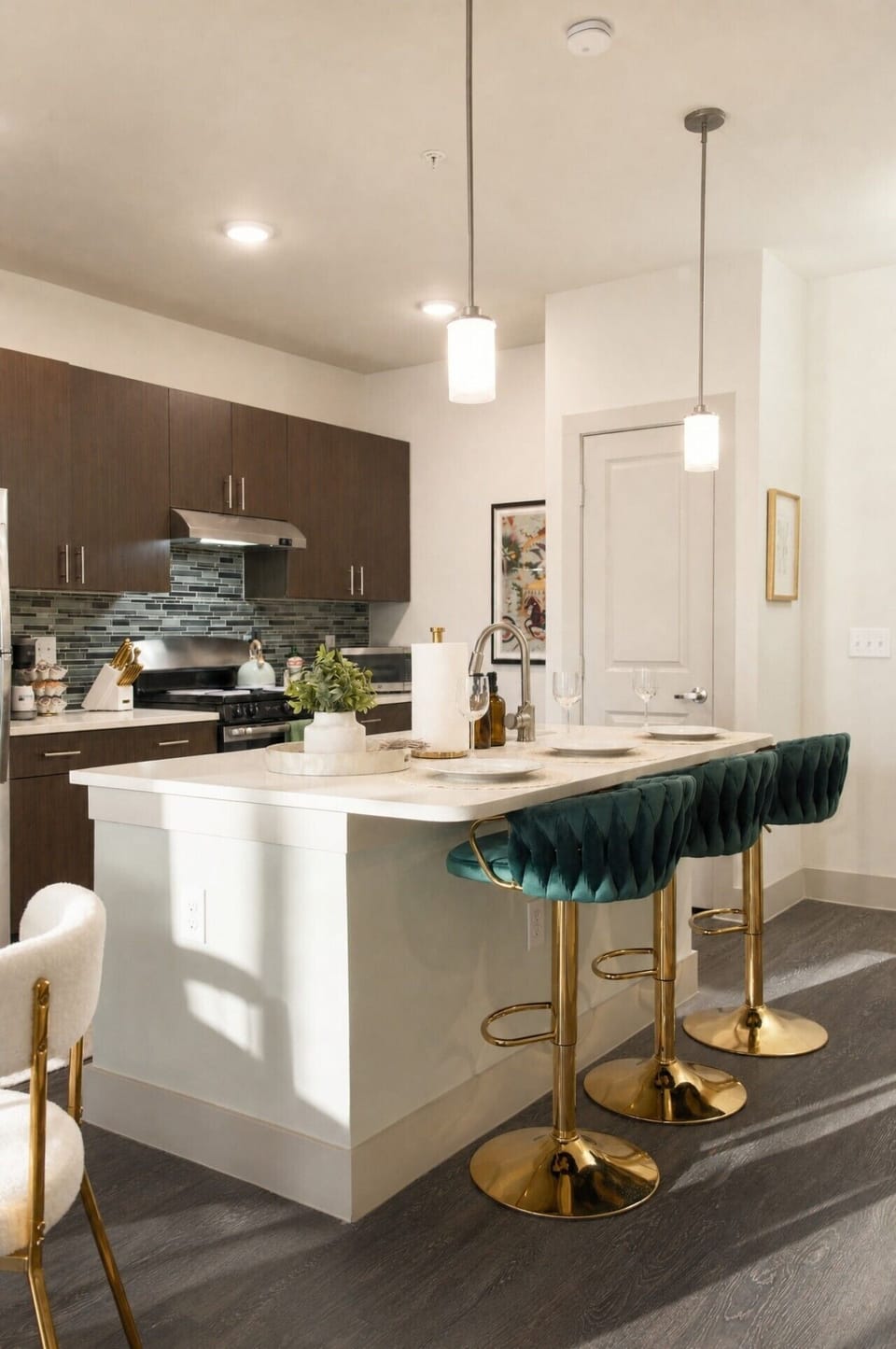 An open-concept kitchen island with luxury velvet seating—perfect for morning breakfasts or evening wine with friends.