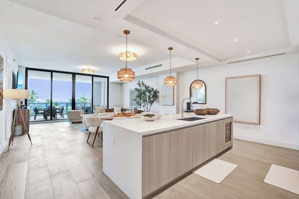 Open-plan kitchen flowing to ocean-view living