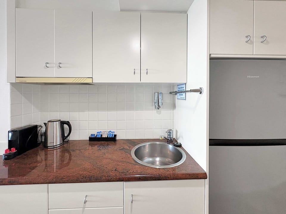 Well Equipped Kitchen with Full Size Fridge