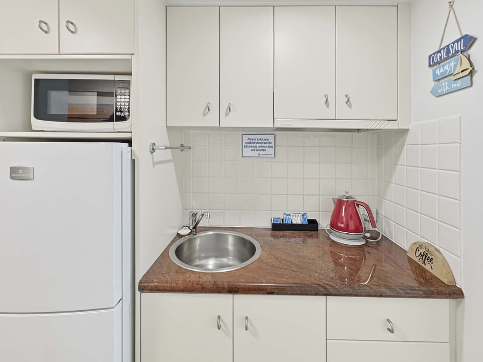 Kitchen with Full Size Fridge & Essentials