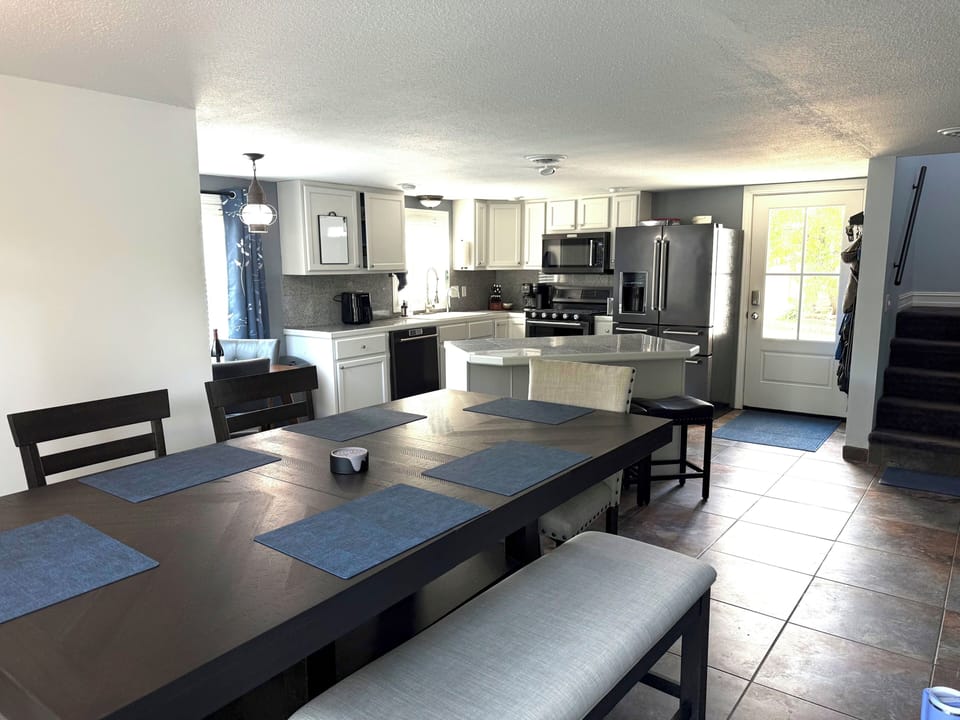 Bright open dining area with modern kitchen and island seating