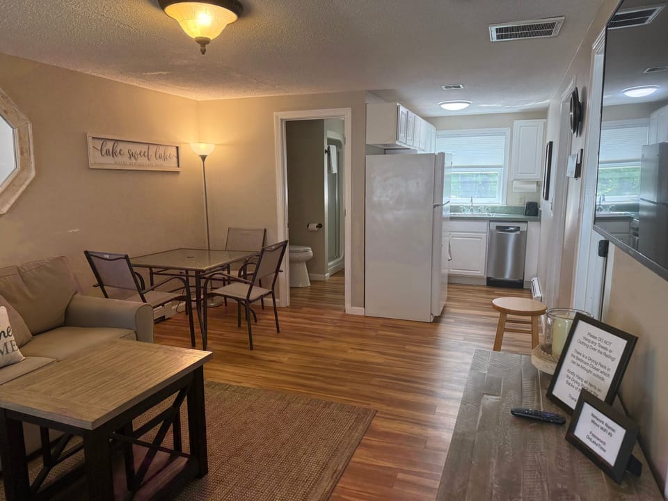Cozy open living area with dining space and bright, functional kitchen