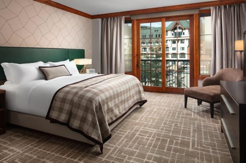 Cozy, light-filled bedroom with balcony views and elegant finishes