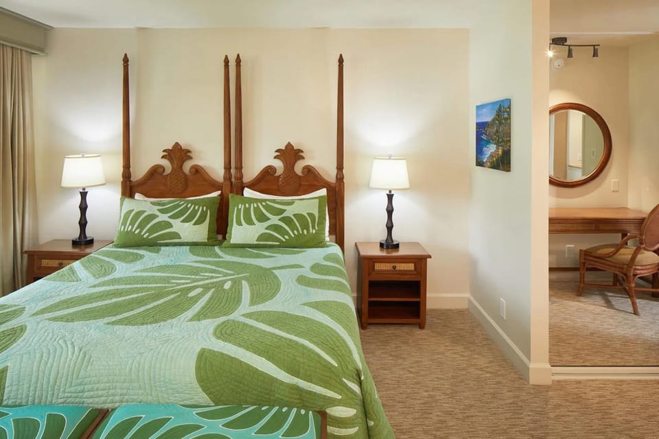 Bright tropical bedroom with four-poster bed and private vanity area