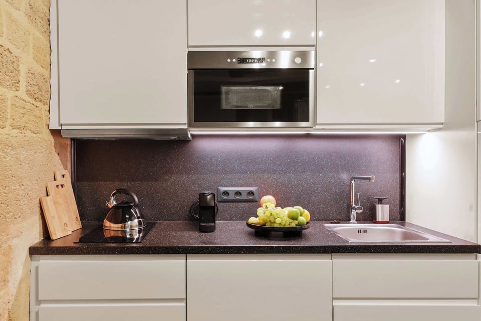 The kitchen is fully equipped to prepare a simple meal 
