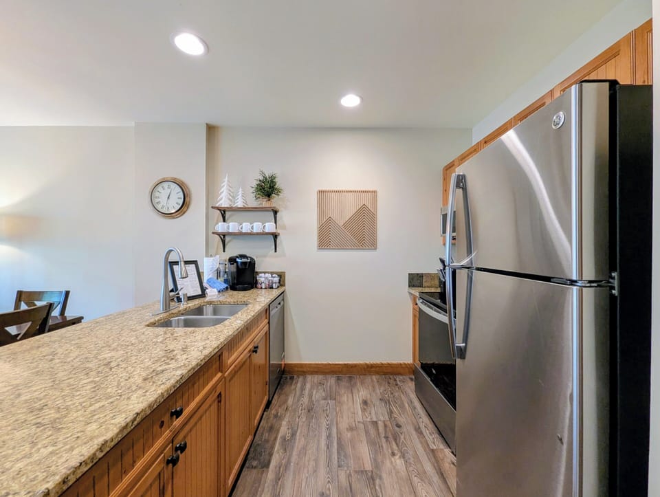 Your fully equipped kitchen features granite countertops, stainless steel appliances, and everything you need to prepare meals at your own pace during your mountain getaway.