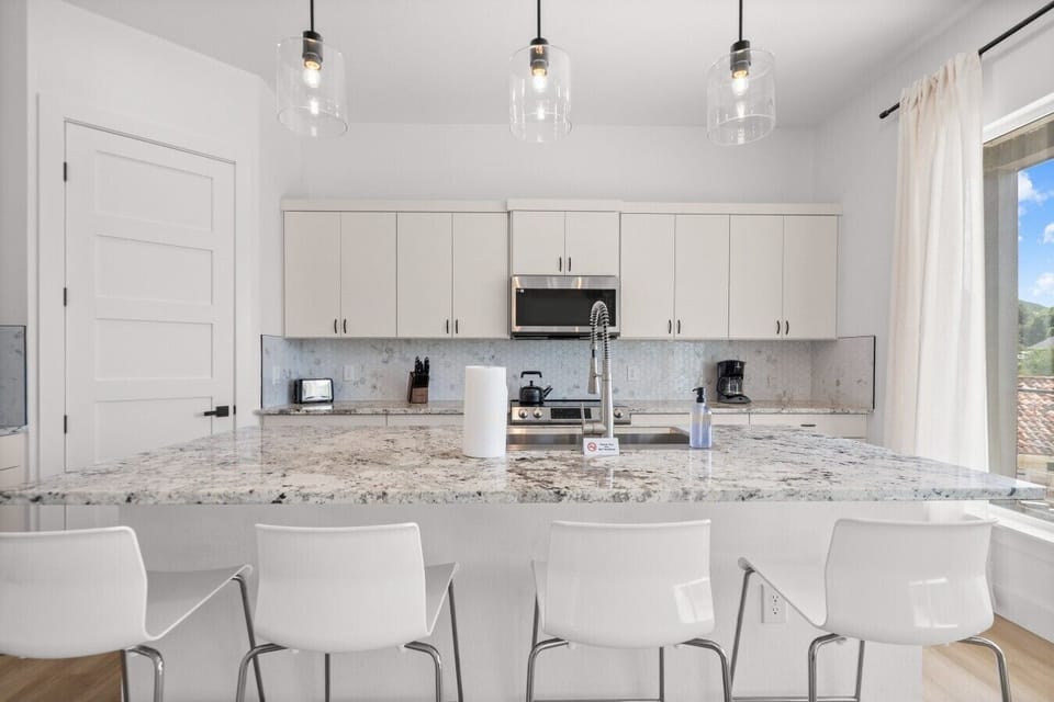 Spread out on the roomy granite island while sunlight pours through the window behind the range.