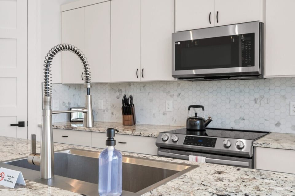 Prep meals at the granite island with a full electric range and everything you need close at hand.