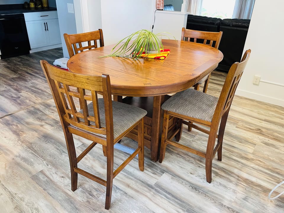 Cozy round dining table for 4 in a bright open-concept space