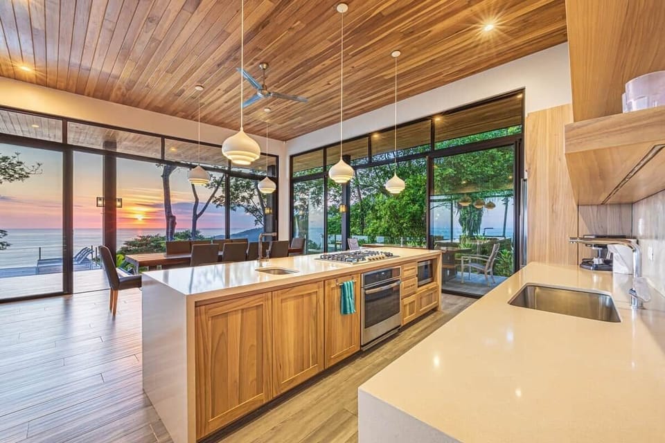 Open concept modern kitchen fully equipped, perfect for private chef dinner service, overlooking the ocean. 