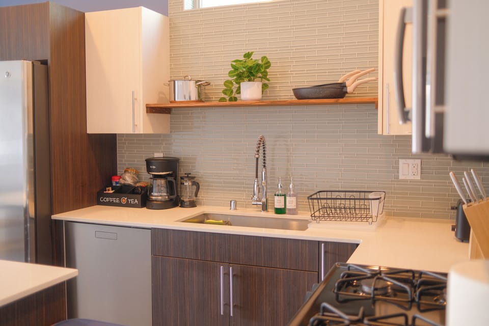 Fully stocked kitchen! Coffee and tea are available along with a drip maker and French press. The kitchen comes fully stocked with spices, oil, and cooking essentials plus a full-size fridge, dishwasher, and deep sink with sprayer.