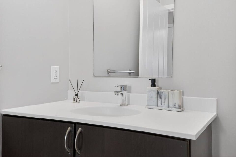 Bathroom vanity with counter space and storage.