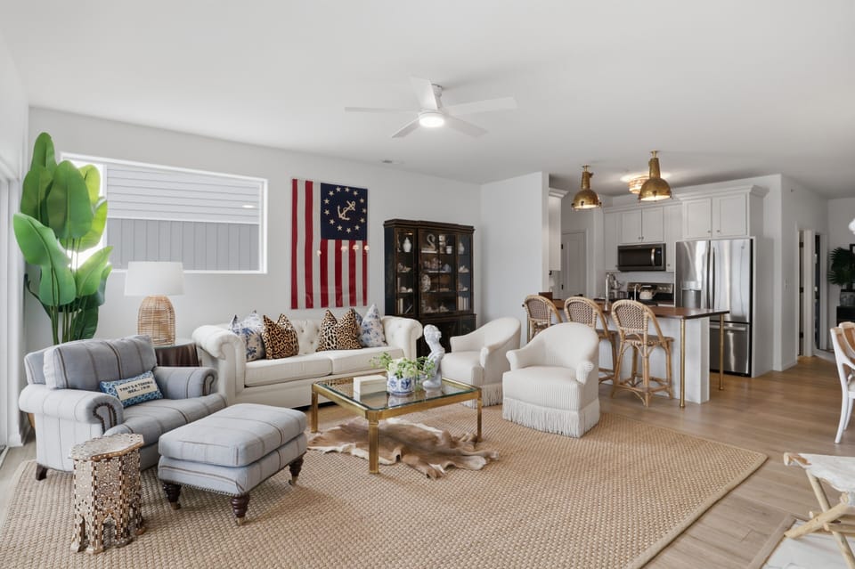 Bright open living space with cozy seating and stylish kitchen bar