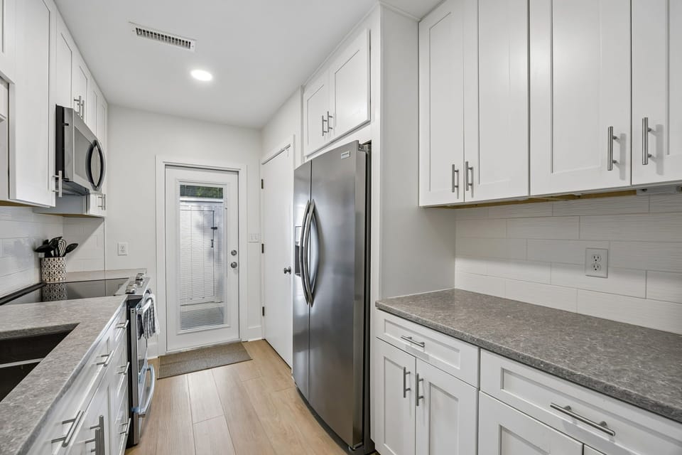 Kitchen with entrance to private courtyard area