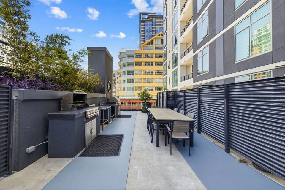 Enjoy outdoor grilling at the shared community BBQ area.