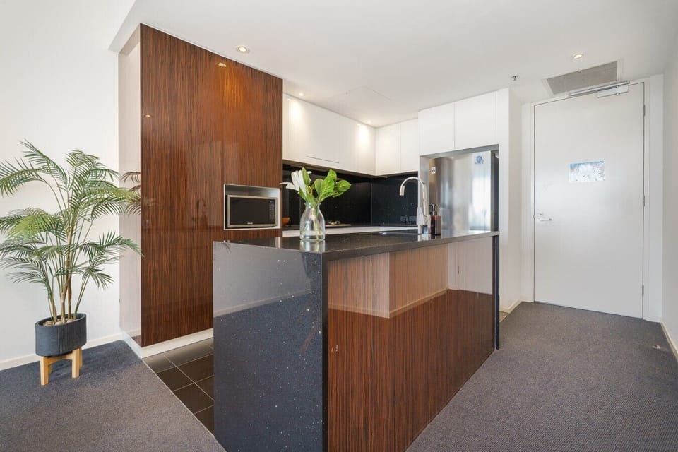 A beautifully appointed kitchen with modern appliances and plenty of bench space, ready for everything from quick breakfasts to family dinners.