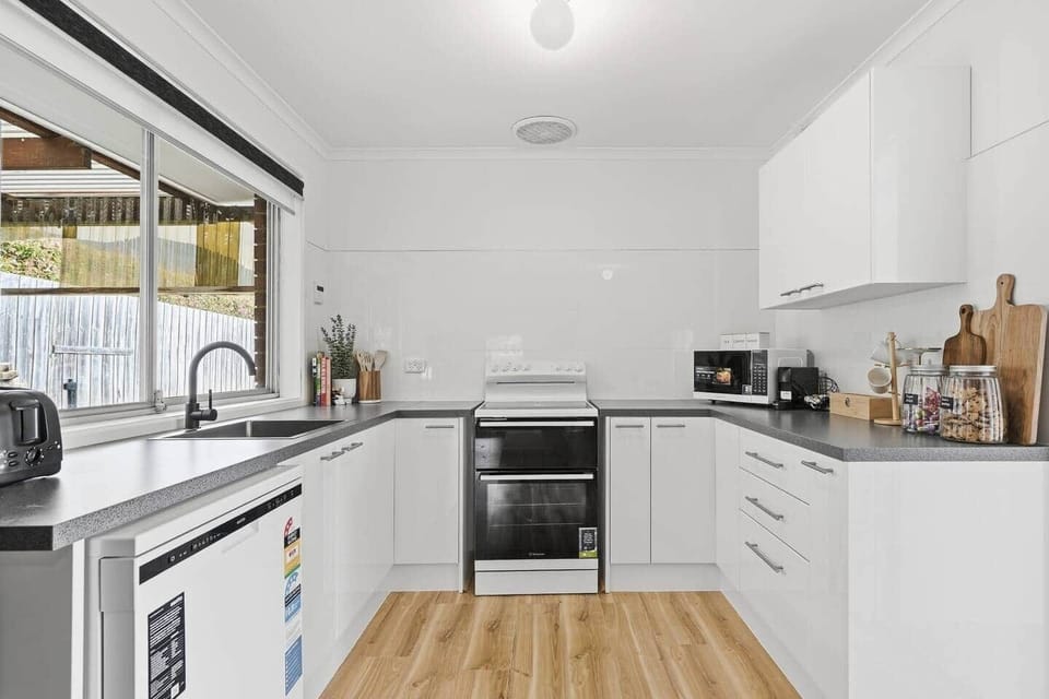Fully equipped kitchen with modern appliances and everything needed to prepare meals during your stay.