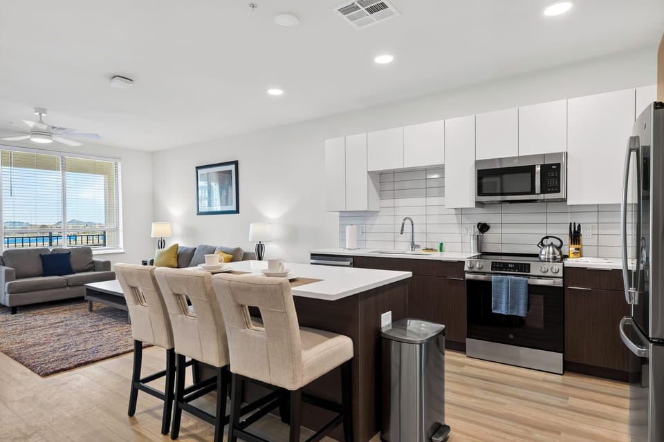 Prepare meals in the fully equipped kitchen, complete with modern appliances and island seating.