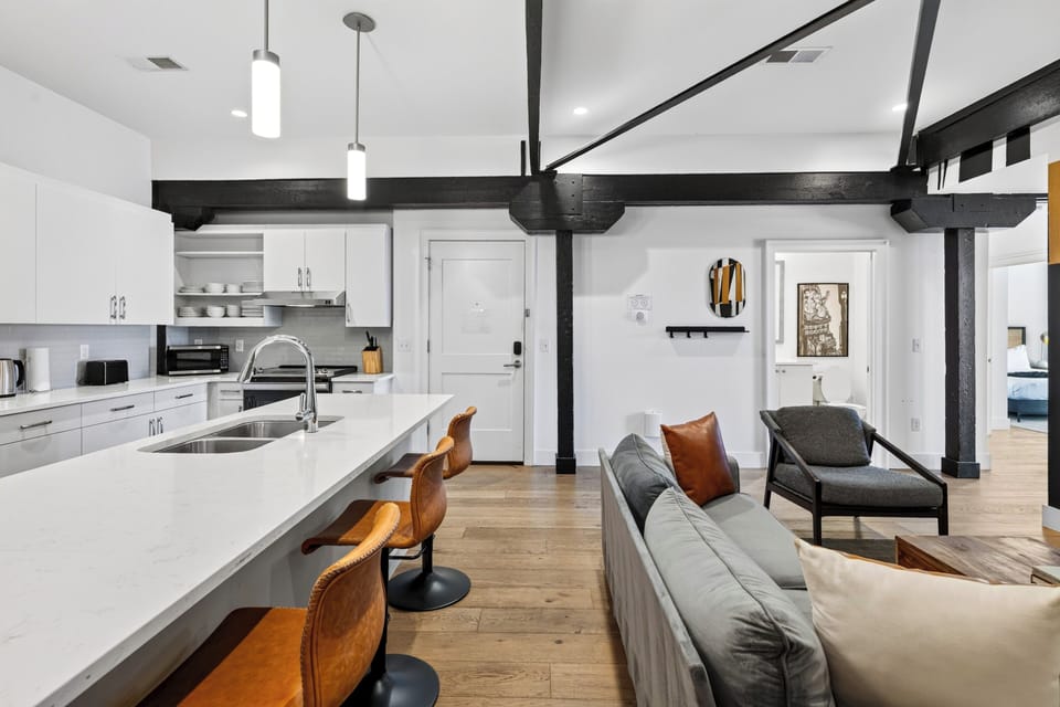 Grab a drink and gather around—the open flow is designed for easy socializing.