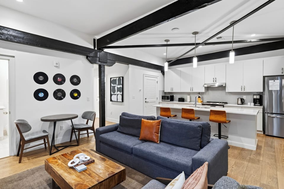 An effortless flow from the living room to the fully equipped kitchen makes entertaining easy.