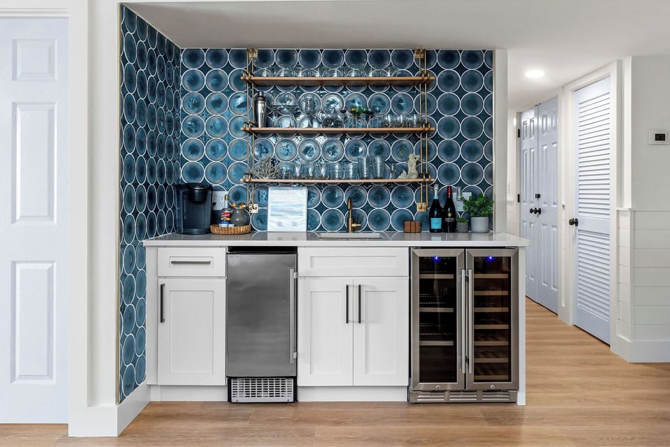 Your entire wet bar awaits! Wine glasses are clean and ready in the upper bistro shelving for a quiet drink at the patio tale after the sun goes down.