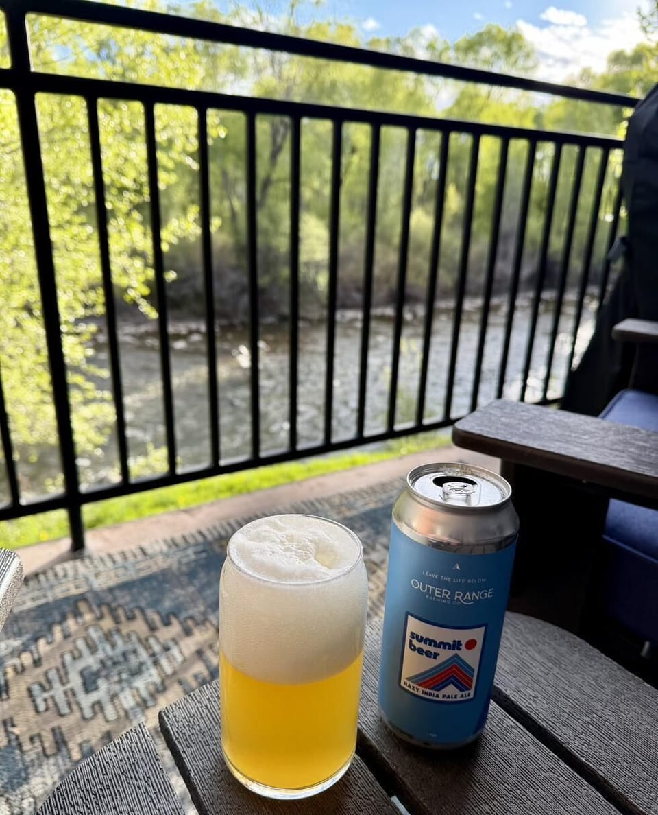 Enjoy a beer at golden hour, overlooking the Roaring Fork steps below.