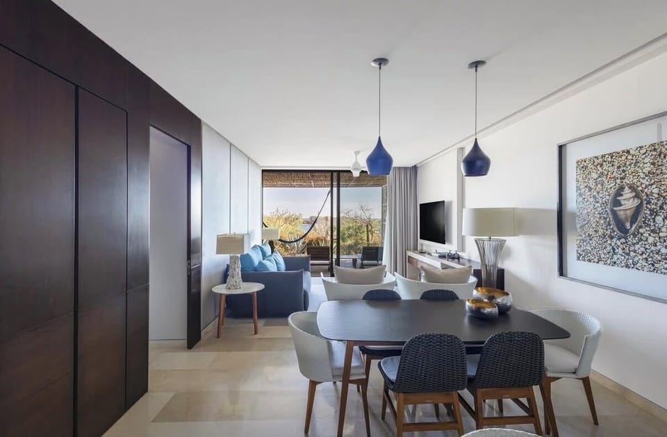 Living room, dining room, patio. *Note: Patio view may differ depending on unit.