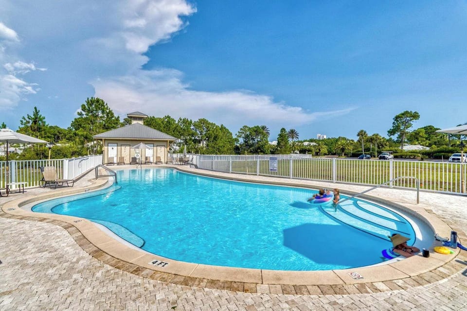Beautiful resort-style pool is located just steps away from the front door of condo.