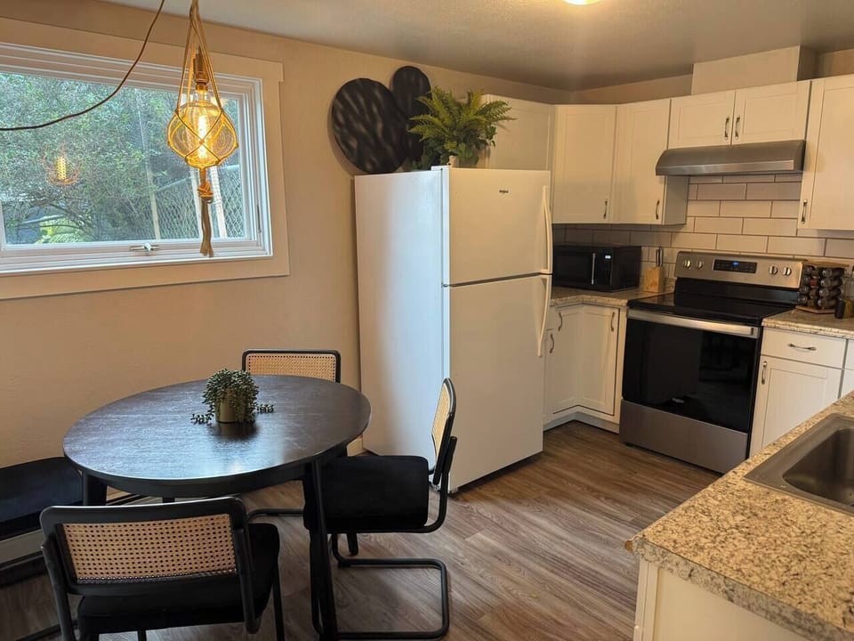 Enjoy meals in the bright dining nook, conveniently located beside the fully equipped kitchen and filled with natural light.