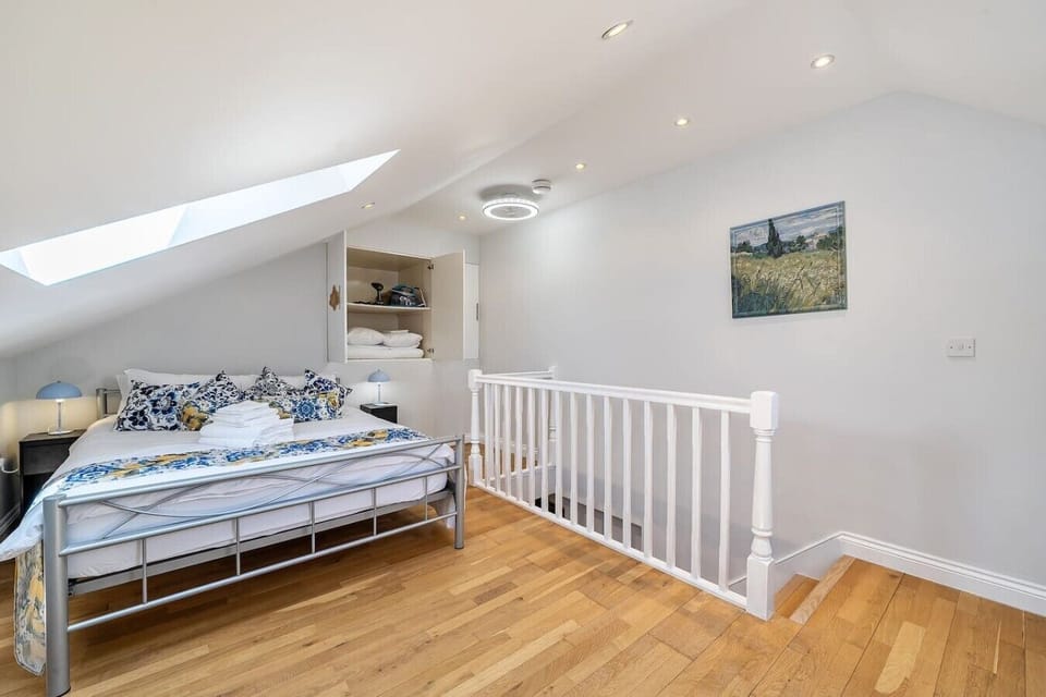 Peaceful bedroom with skylight and clever storage