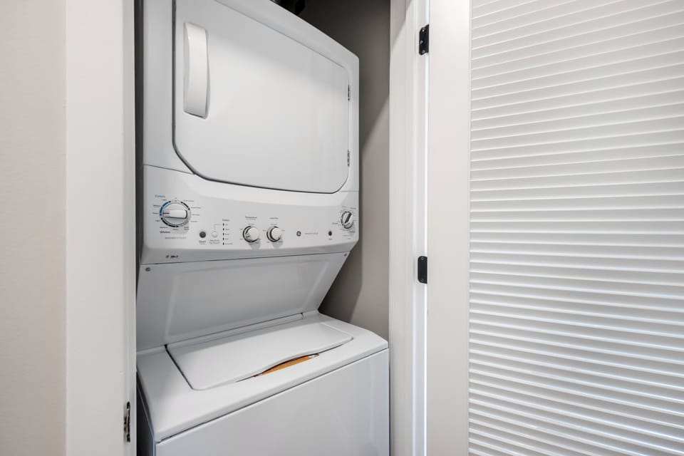 Pack light and enjoy the convenience of an in-unit stacked washer and dryer, neatly tucked away in a dedicated laundry closet.
