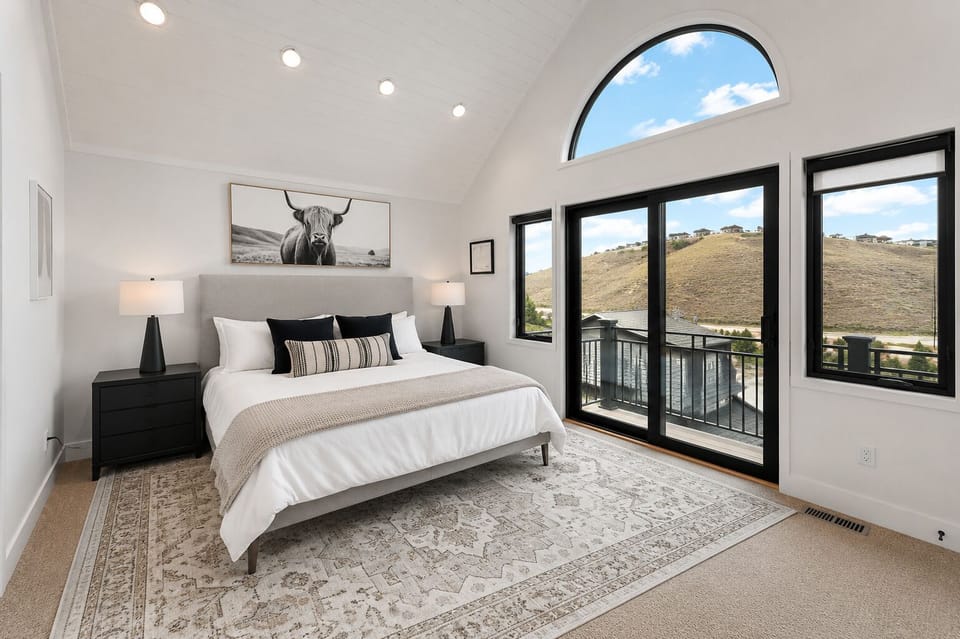 Master bedroom with vaulted ceilings, custom closets, views and en suite bathroo