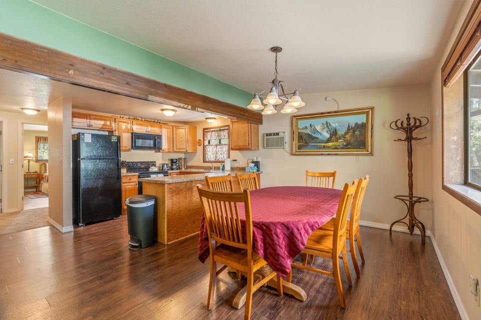 Dining table with chairs for 6 guests just off of the kitchen.