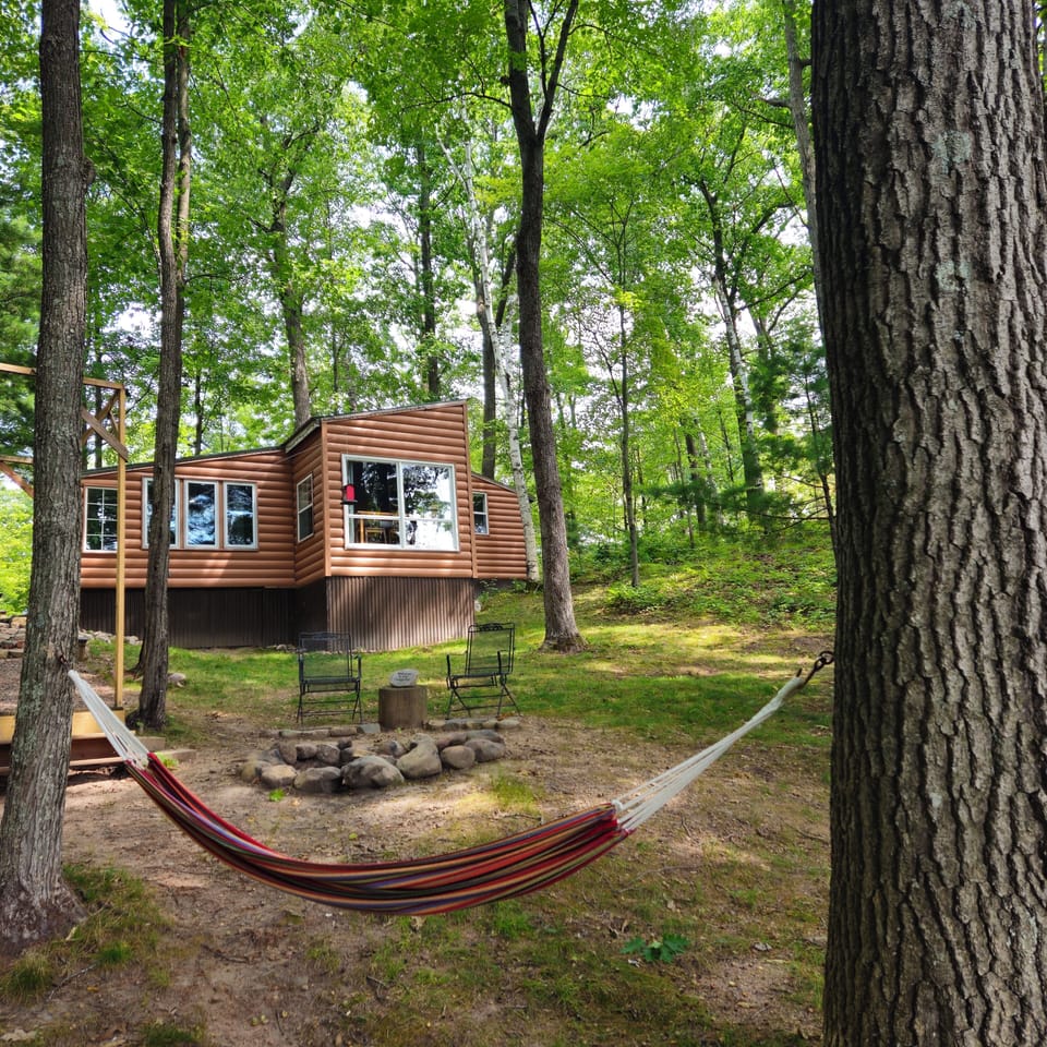 The hammock is calling your name! Come relax by the lake.