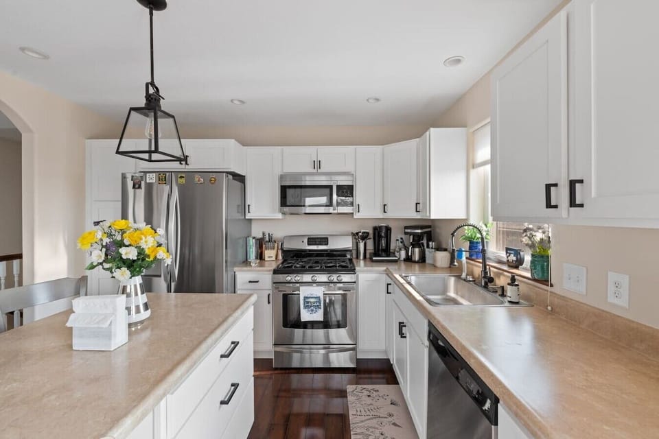 Skip takeout and enjoy home-cooked meals in our fully stocked kitchen. Designed for convenience with a refrigerator, stove, microwave, toaster, and coffee station.