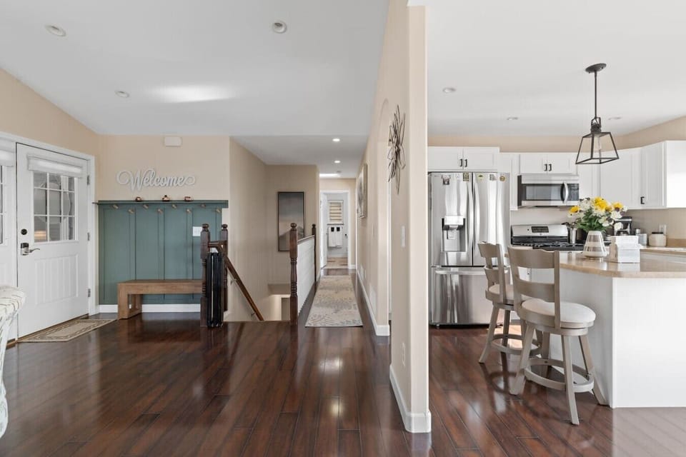 From the moment you walk through the door, you`ll be welcomed by a bright, charming entryway featuring a convenient bench, coat hooks, and a warm `Welcome` sign that instantly makes you feel at home. Every adventure begins here!