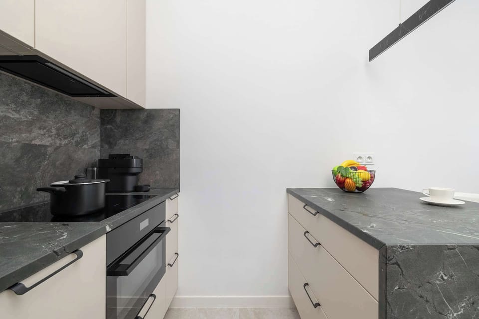 Compact and modern kitchenette with practical storage and appliances.