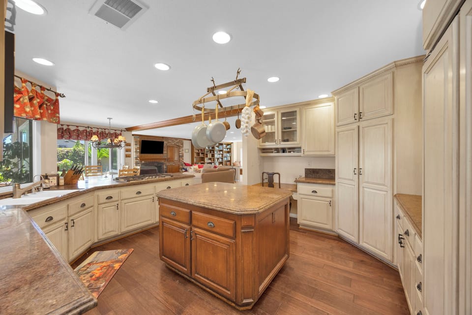 Spacious gourmet kitchen with a large center island, abundant prep space, and an open layout perfect for gathering.