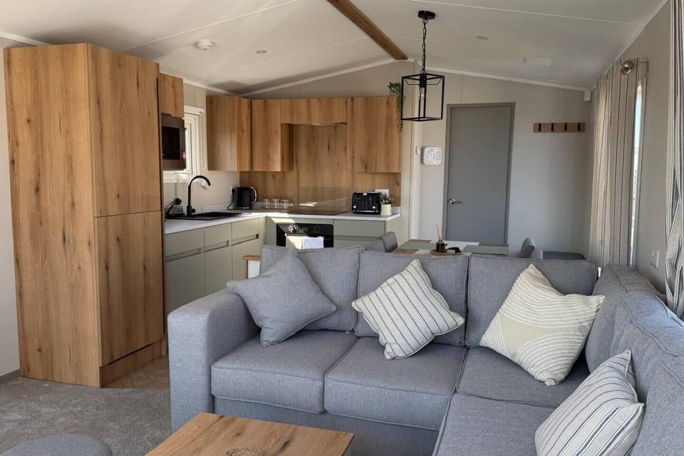 Stretch out on the comfy corner sofa and enjoy quality time together after a day of adventures in Britain's sunniest place. 